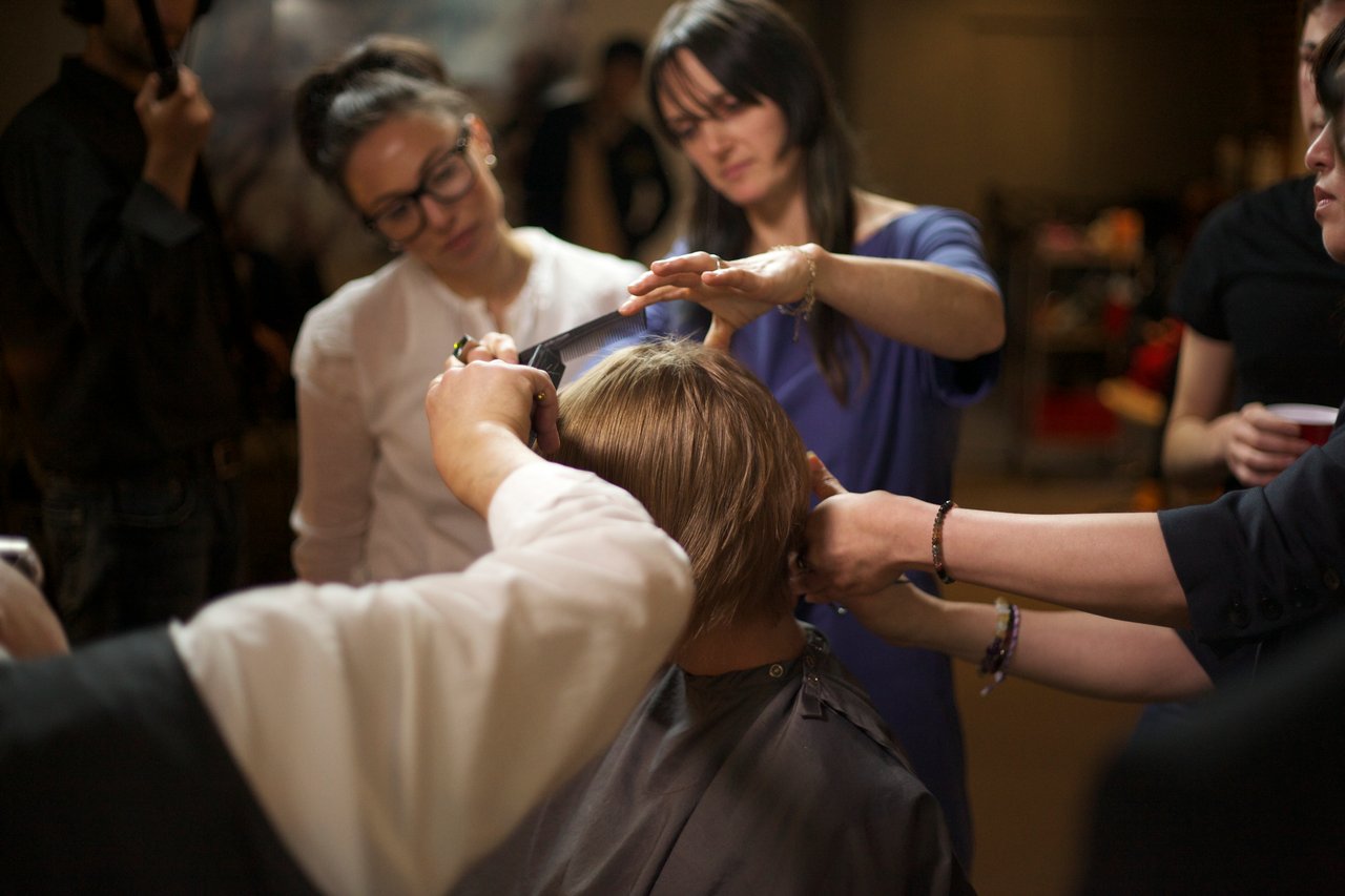 Video still: Koki Tanaka, A Haircut by 9 Hairdressers at Once (Second Attempt), 2010